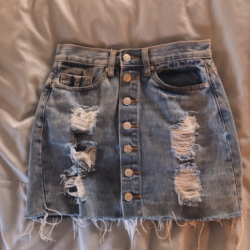 a trendy ripped jean skirt